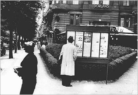 A  Berlin pedestrian stops to read an issue of the antisemitic newspaper Der Stuermer